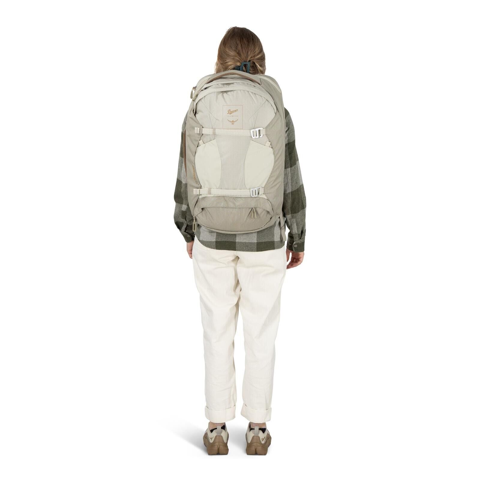 Model on-body image of Osprey Fairview 40 and Danner collaboration in the color Sandy Grey-Sawdust