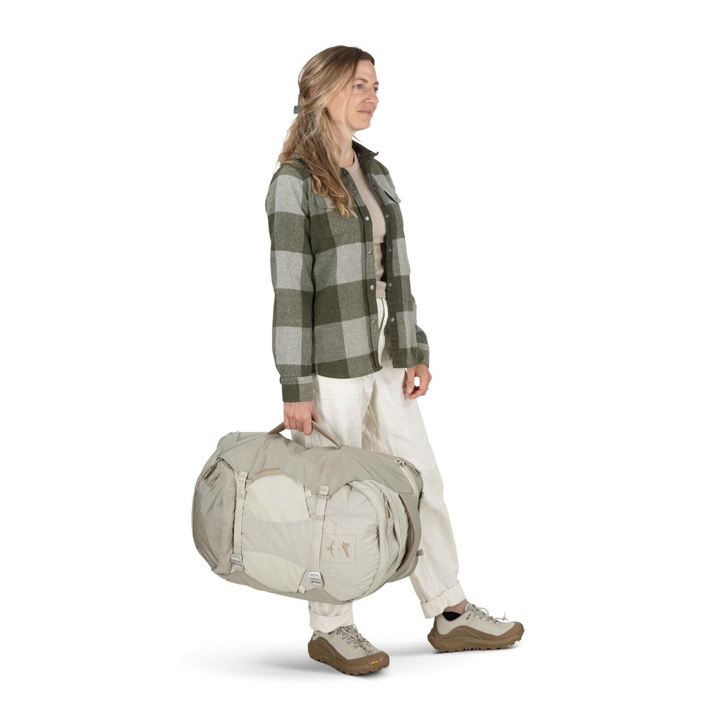 Model on-body image of Osprey Fairview 40 and Danner collaboration in the color Sandy Grey-Sawdust