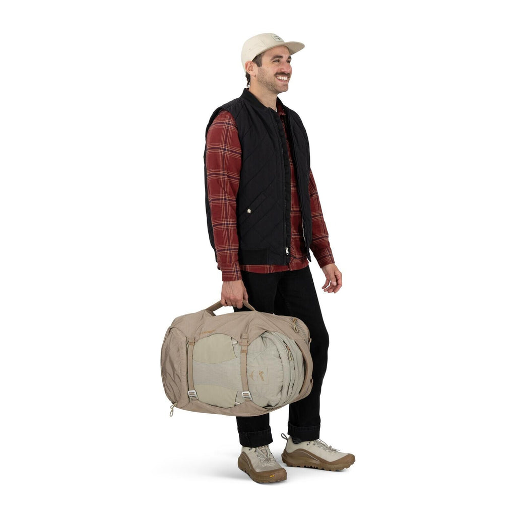 on-body image of Osprey Farpoint 40 and Danner collaboration in the color Sandy Grey-Sawdust