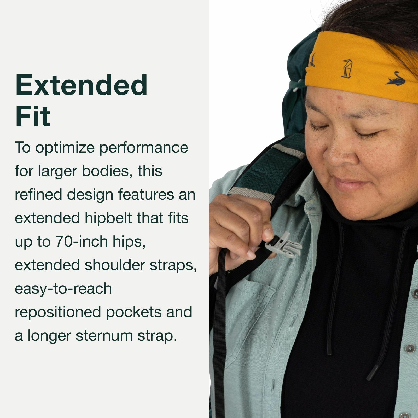 A person adjusts their backpack, showcasing its extended hipbelt and shoulder straps designed for larger bodies.