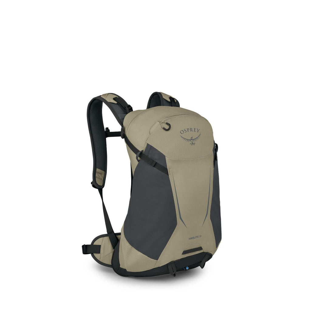 The image depicts an Osprey Hikelite 18 backpack in a three-quarter view. The backpack is primarily beige with dark gray panels on the sides, featuring the Osprey logo at the top. It includes several compartments and pockets for storage and has adjustable