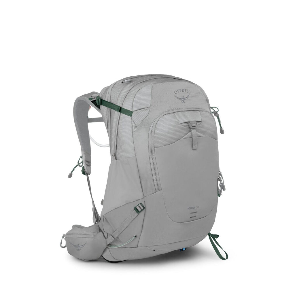 The image showcases an Osprey Mira 34 backpack in a light gray color. It features multiple compartments, including a large main section, a front zip pocket, and smaller pockets on the sides. The backpack is designed with adjustable shoulder straps and a p