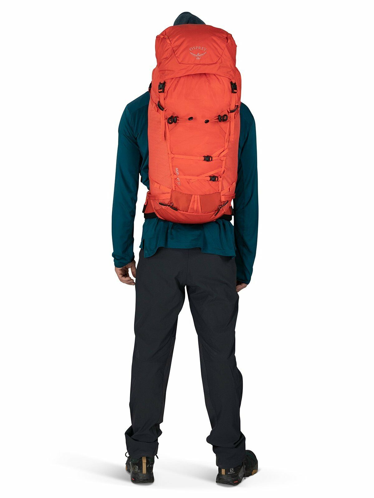 a person modeling the Mutant 38 in color marsorange