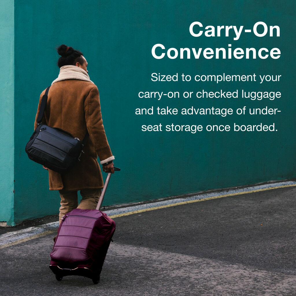 Person walking with a maroon rolling suitcase and black shoulder bag against a teal wall with travel advertisement text.