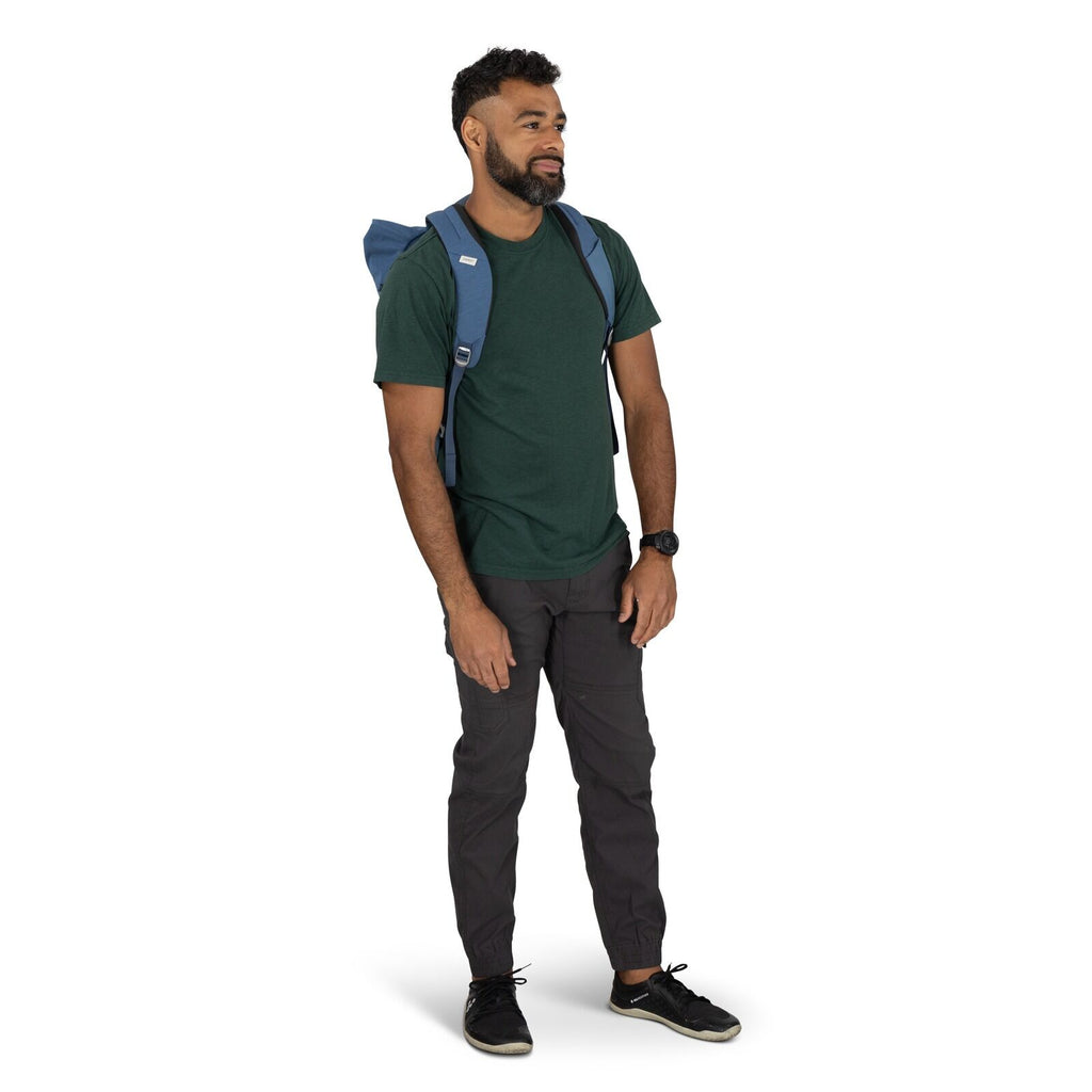 on-body image of the Arcane Roll top pack in the color Nircana Blue Heather