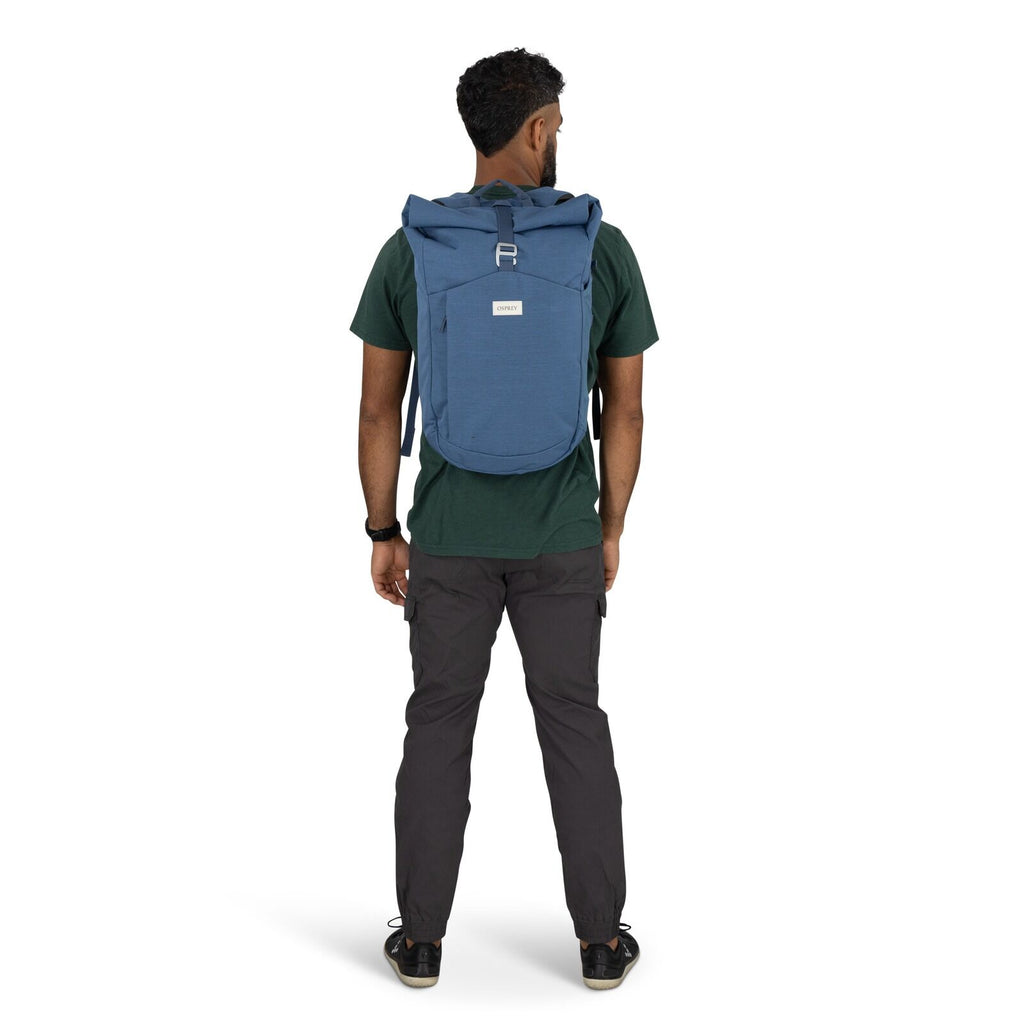 on-body image of the Arcane Roll top pack in the color Nircana Blue Heather