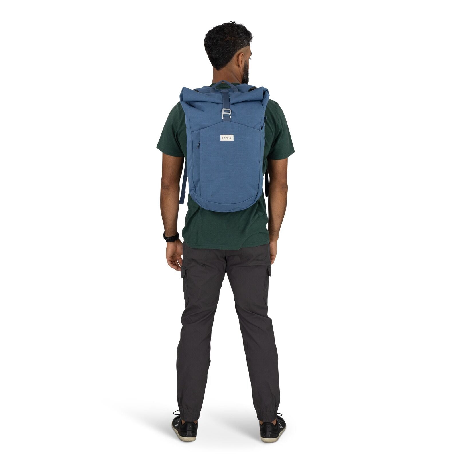 on-body image of the Arcane Roll top pack in the color Nircana Blue Heather