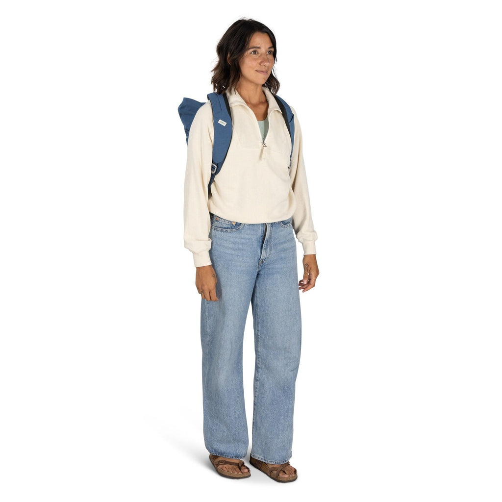 on-body image of the Arcane Roll top pack in the color Nircana Blue Heather
