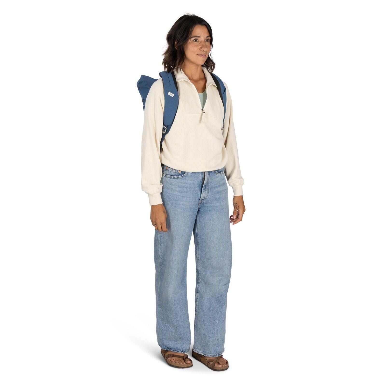 on-body image of the Arcane Roll top pack in the color Nircana Blue Heather