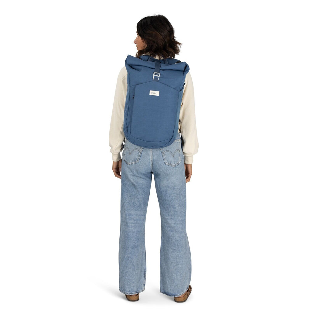 on-body image of the Arcane Roll top pack in the color Nircana Blue Heather