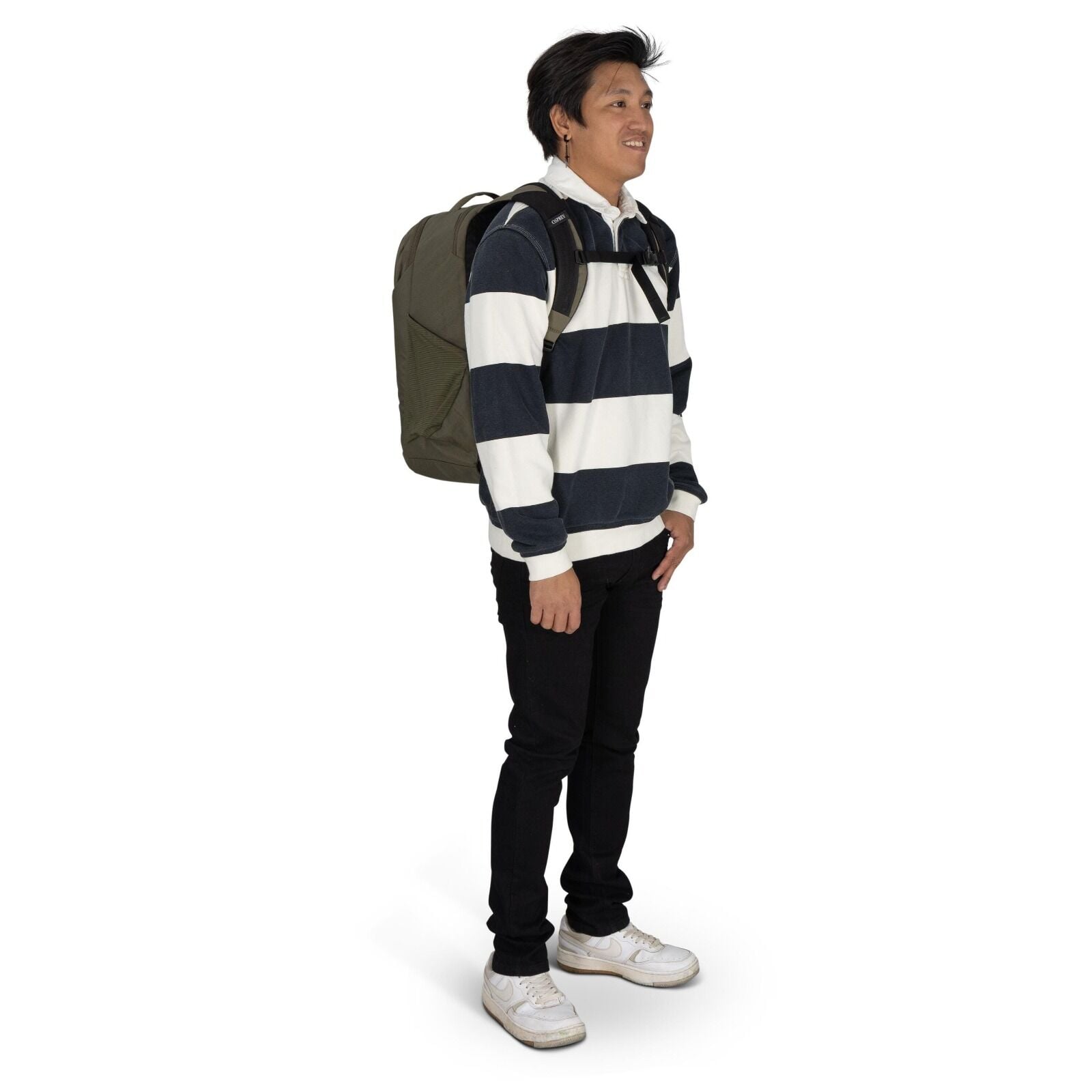 The image shows a person standing and wearing a casual outfit, which consists of a long-sleeve rugby-style shirt with broad horizontal stripes in white and dark blue. The individual is also wearing black pants and white sneakers with visible wear. They ar