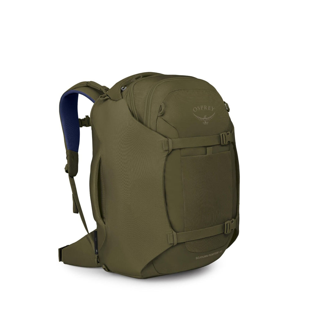 A green Osprey backpack is shown from a three-quarter angle on a white background. It has a streamlined, travel-ready design with a large front panel, compression straps, and multiple zippered compartments. The shoulder straps and hip belt are padded, wit