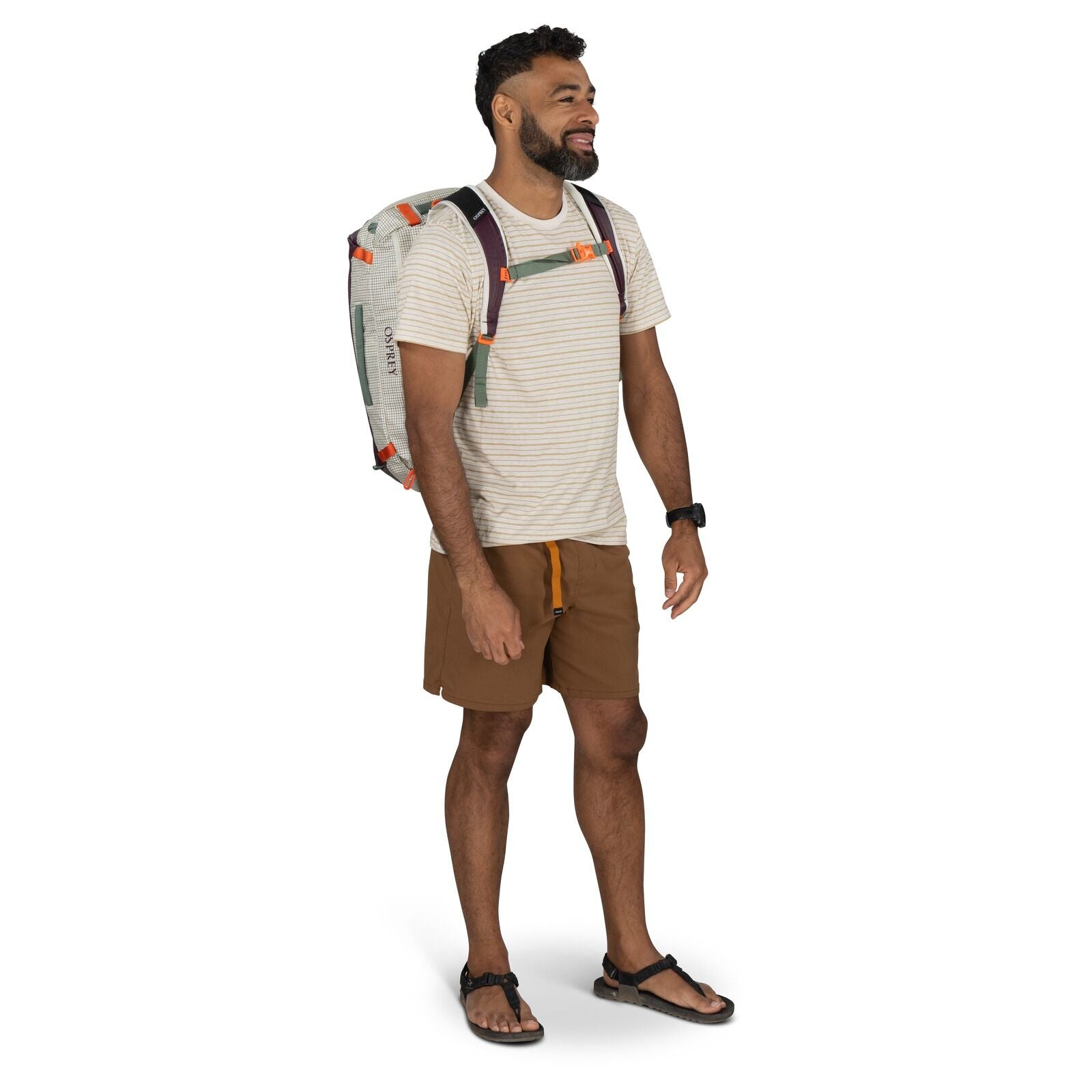 The image features a person standing and wearing a duffel bag.