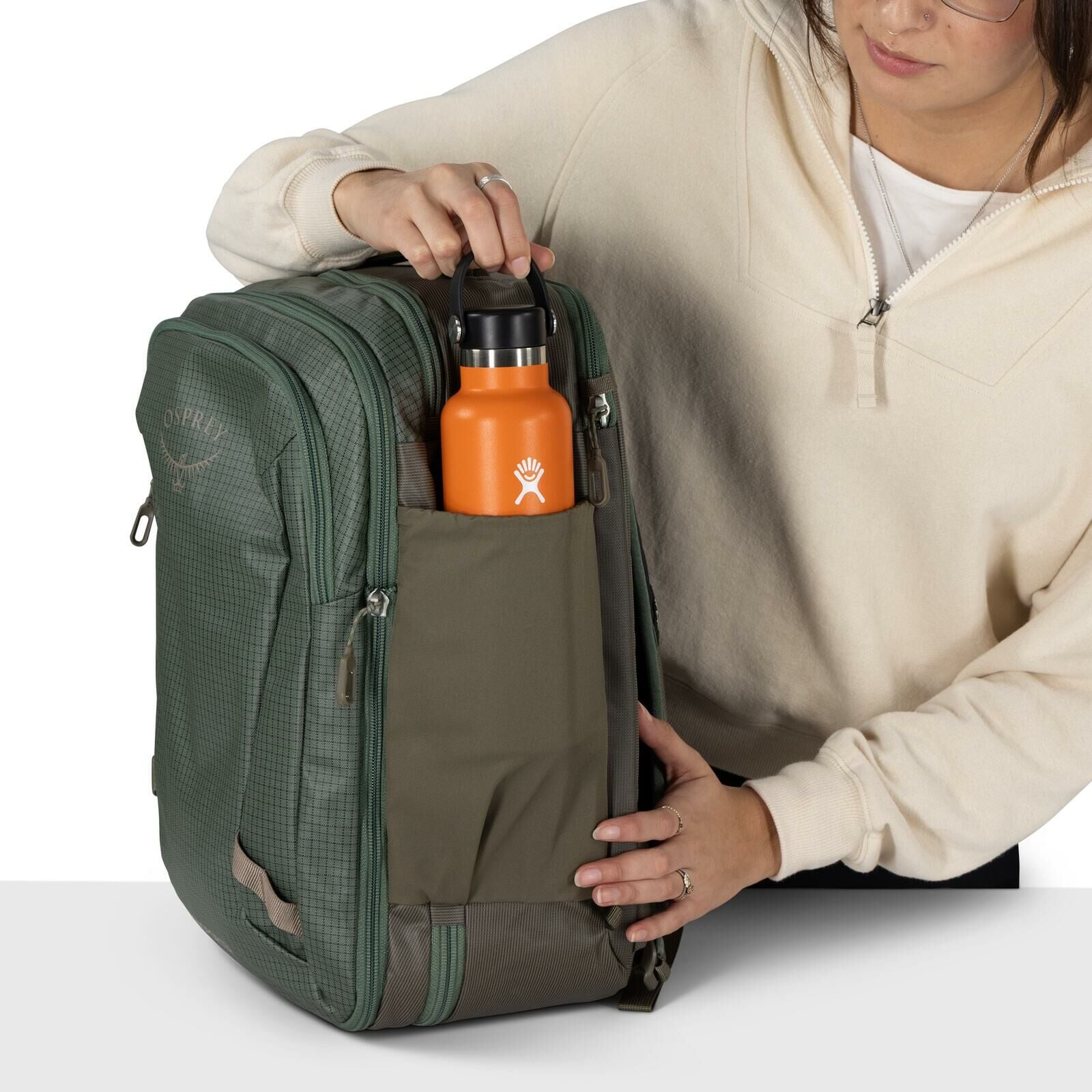 detail image of Osprey's Transporter Travel Pack 26+6 in the color Pine Leaf