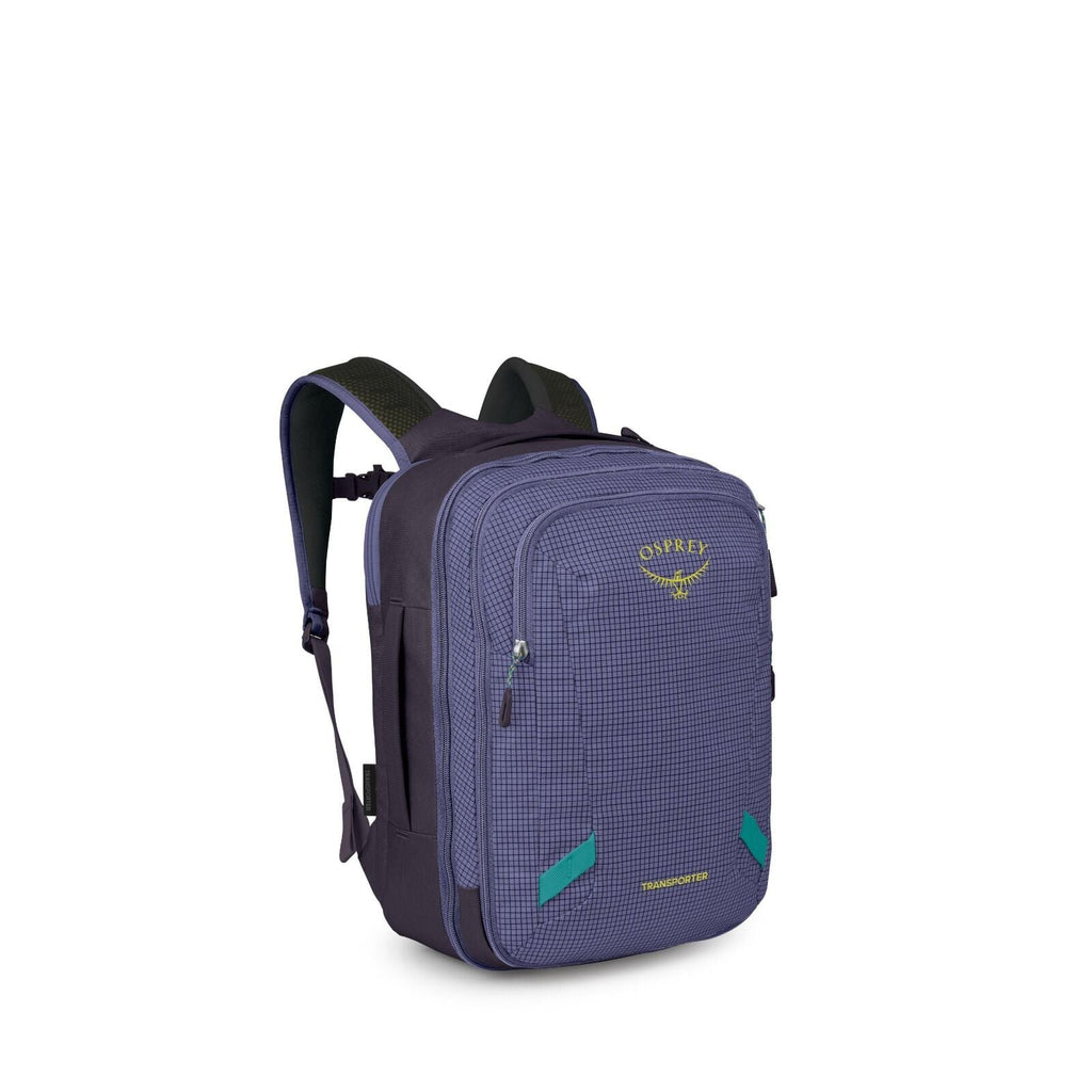 The image shows a compact Osprey backpack in a dark purple/indigo color with a subtle grid pattern. It has two main zippered compartments, a smaller front zip pocket, and padded shoulder straps with breathable mesh. Bright teal accents appear on the zippe