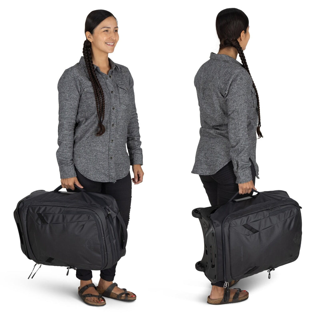 Model holding the Transporter Wheeled carry-on