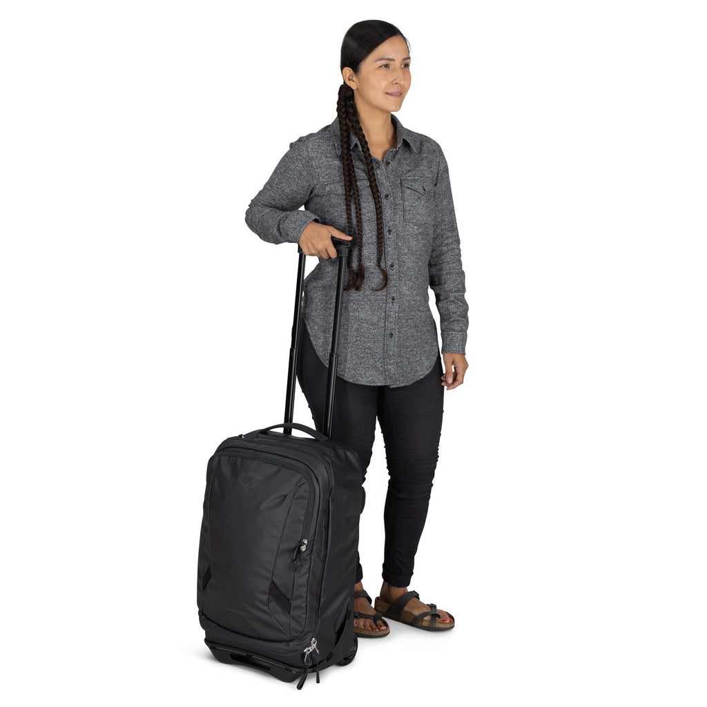 Model holding the Transporter Wheeled carry-on